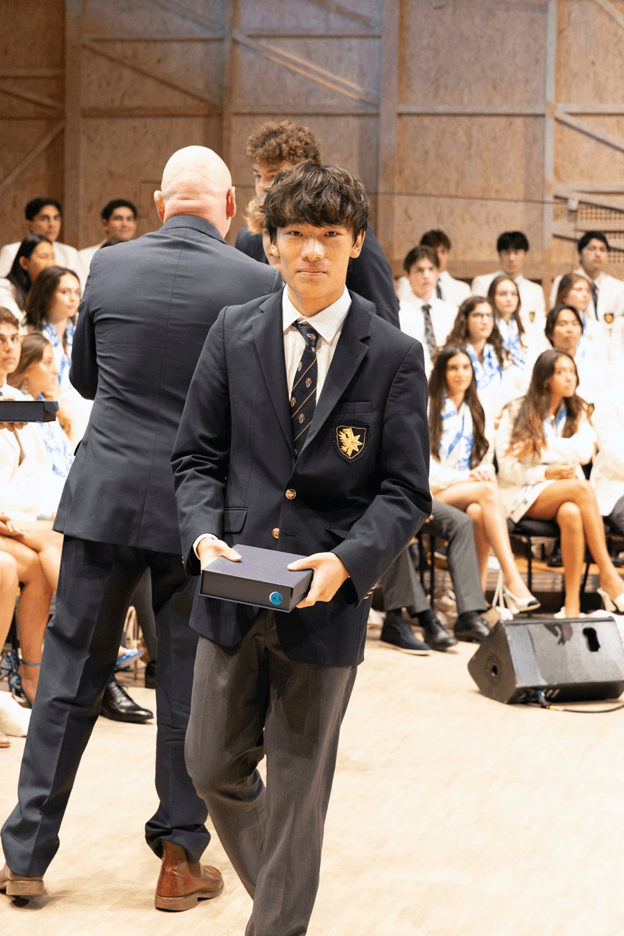 Alan walking back from the stage at a school prize-giving