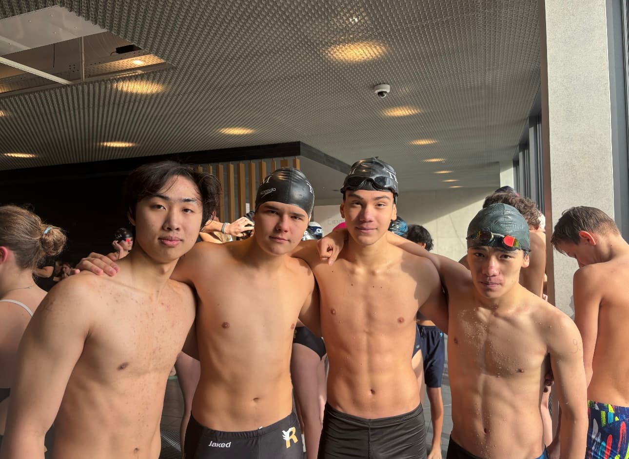 The Le Rosey swim team on deck