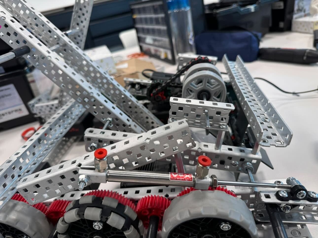 A close-up of the robot’s metal frame and wheels